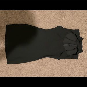 Medium black FashionNova dress. Form-fitting.